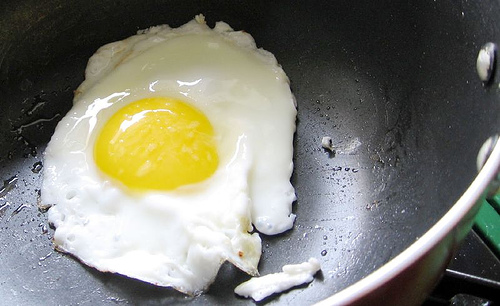 fried egg in non-stick pan by noshowerfamily.