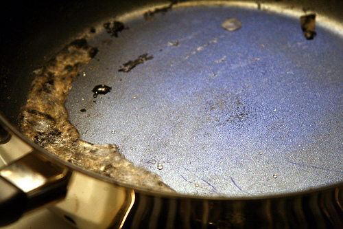 Non-stick pan someone forgot to take off heat by NathanaelB.